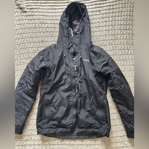 Woman’s warm quilt lined Patagonia rain jacket.